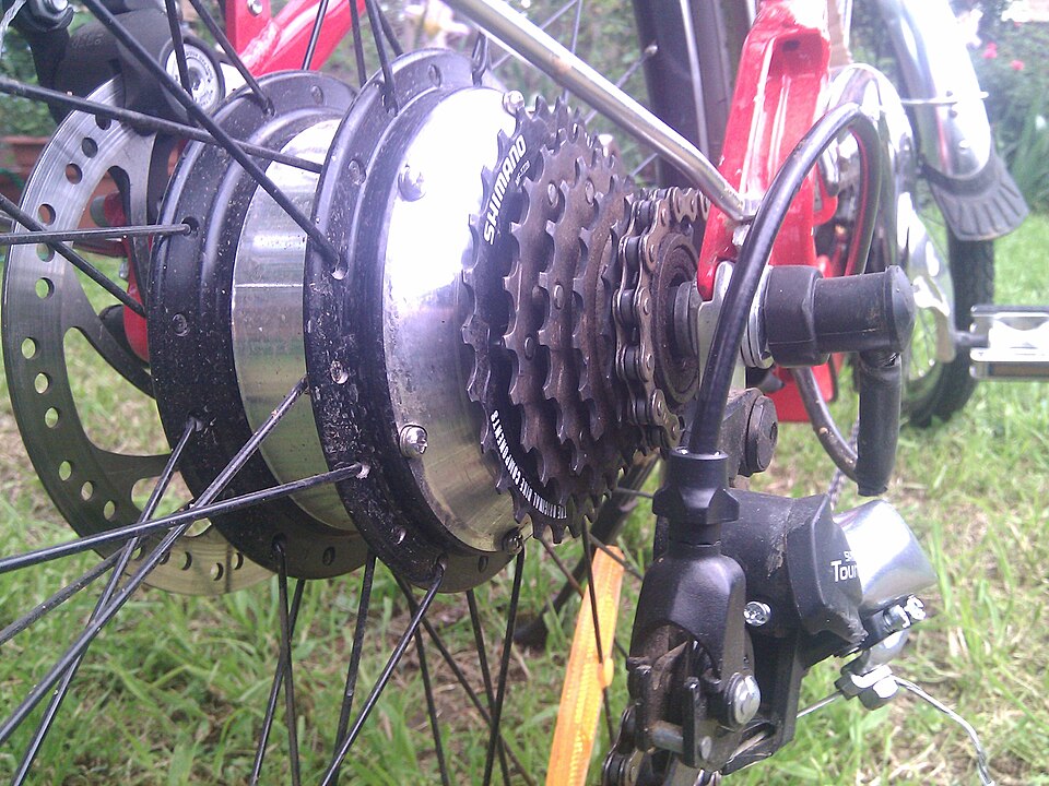 A rear hub motor in an e-bike wheel, with its cable leaving the axle